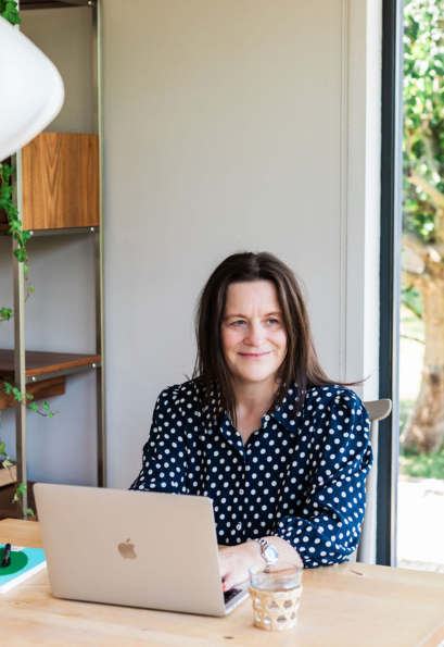 Sarah van Aswegen at a laptop